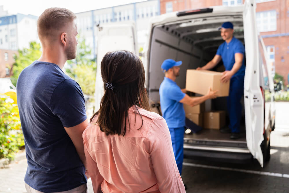 Friendly Palatka moving team unloading furniture